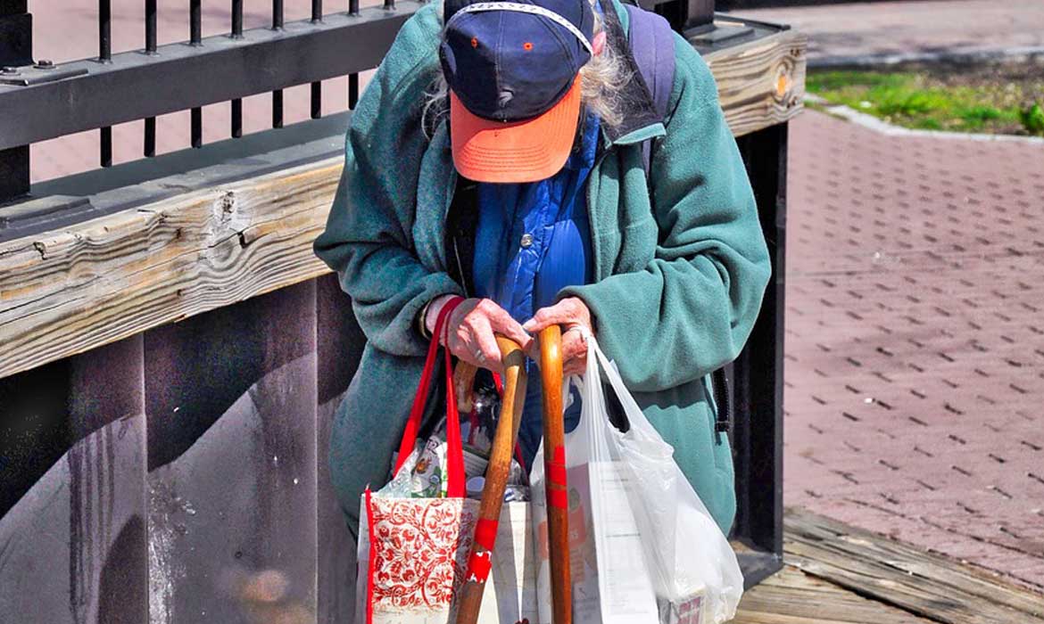 elderly woman with shopping bags