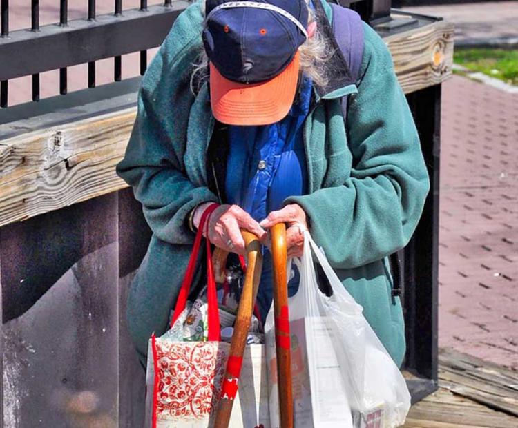 elderly woman with shopping bags